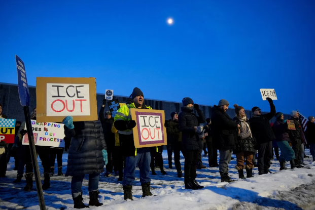 Protesters gather alongside each other asking for justice for Renee Nicole Good in Minnesota.