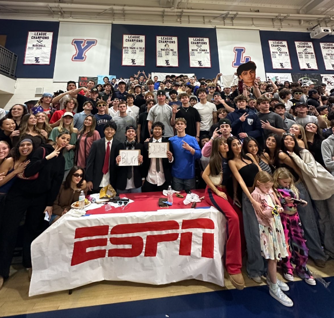 Student and fan section in their frat attire, cheering on the YL Mustangs.