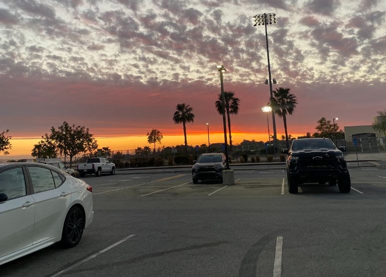A nearly empty parking lot mirroring the vastness of our desires and capturing a moment of transition rather than permanence.
