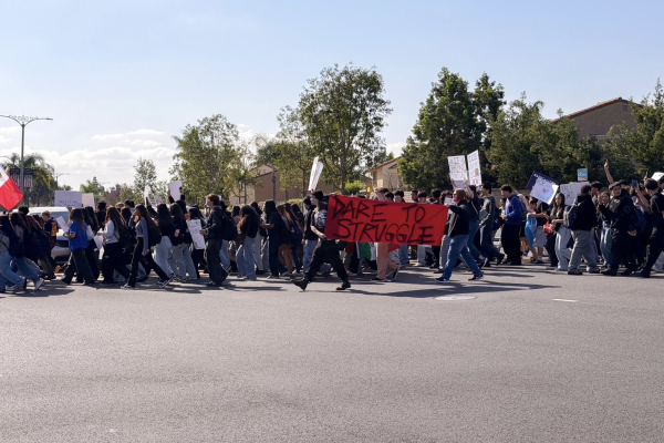 Valencia students crossing Alta Vista Street and Kraemer Boulevard.