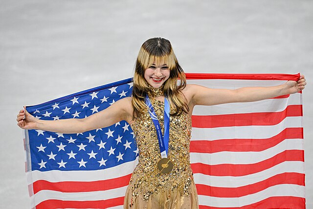 Team USA’s Alysa Liu is golden at the 2026 Winter Olympics, becoming the first American female figure skater to medal in two decades. Alysa Liu by YantsImages is licensed under CC BY-SA 4.0.