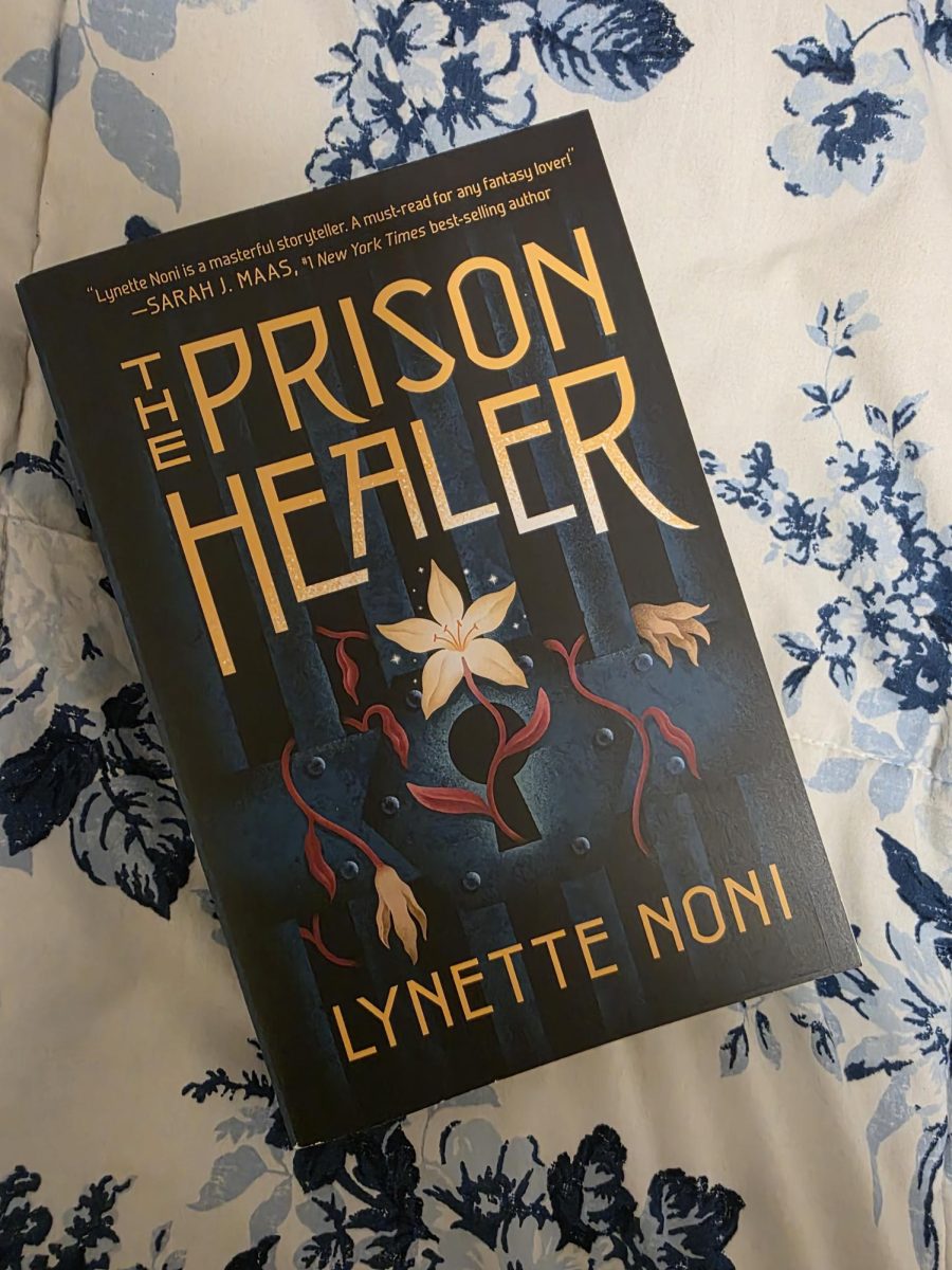 The Prison Healer by Lynette Noni cover, with flowers blooming from the closed lock of a prison door.