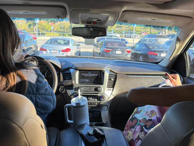 Students lost in thought while sitting in the car, waiting for class to begin. 