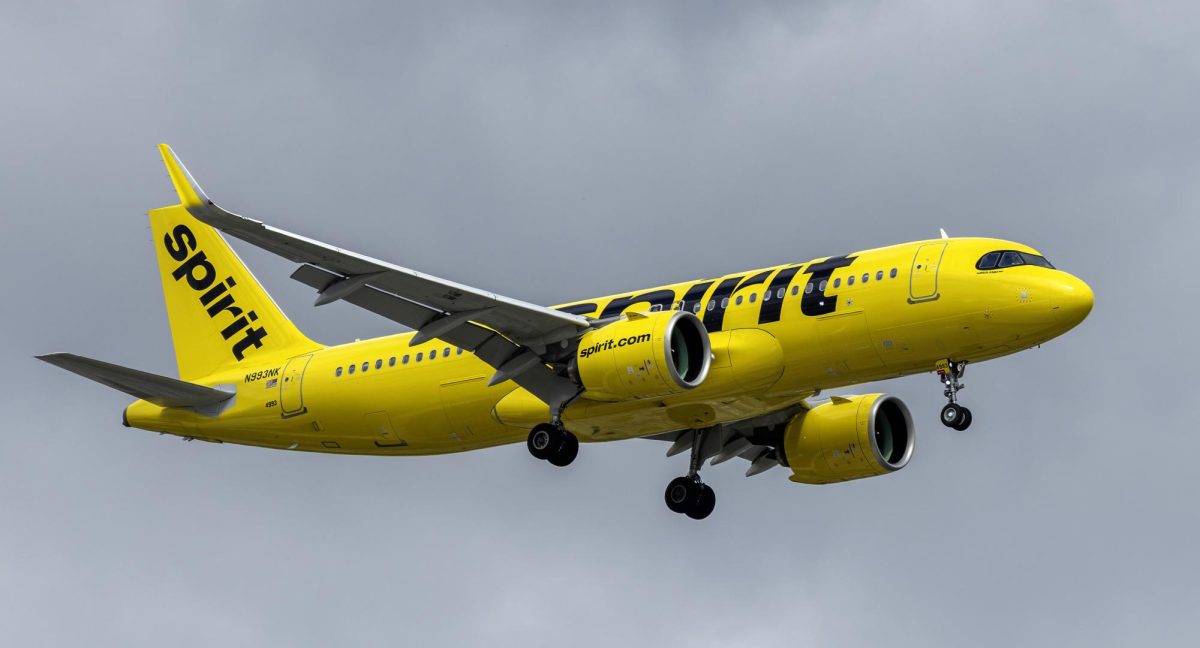 Before it shut down, the iconic yellow Spirit Airlines is shown flying in the sky.